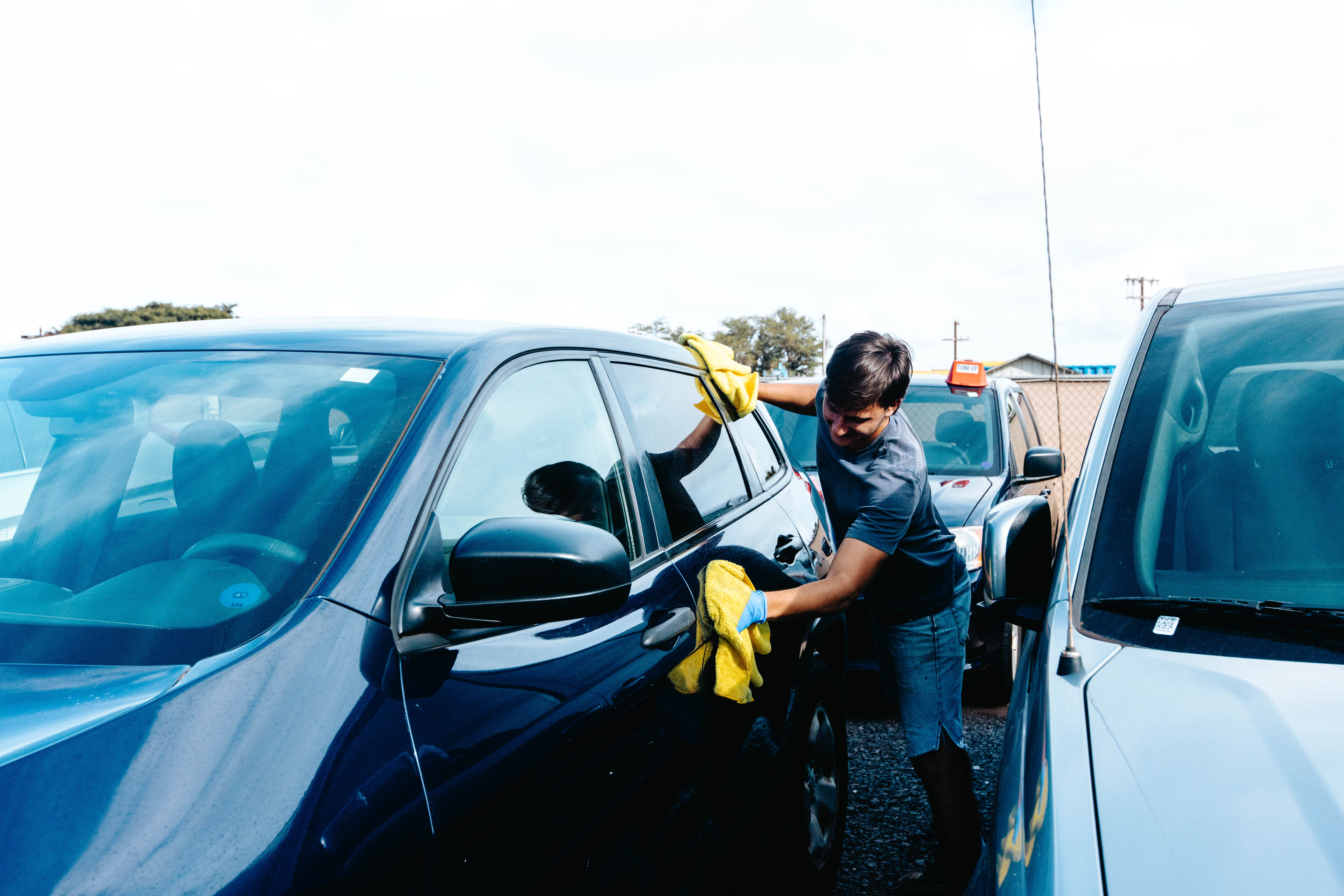 Makoa Rental Car Maui staff detailing and cleaning a rental vehicle in Kahului